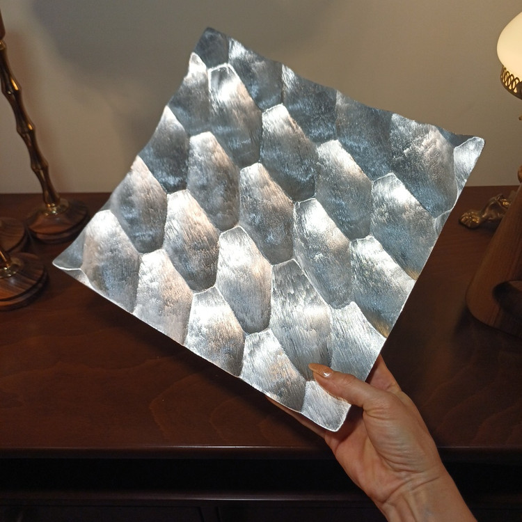 Close-up view of the aluminum honeycomb serving tray texture and glossy finish