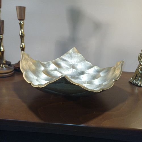 “Aluminum serving bowl with honeycomb (hive) design and curved raised rim, leaf-like edge pattern.”