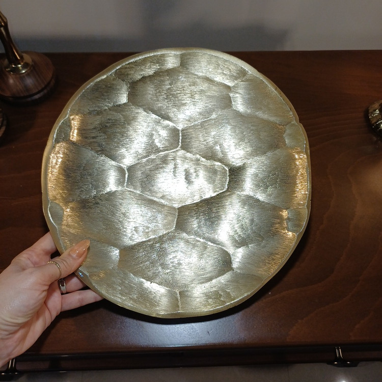“Round aluminum serving tray with honeycomb pattern and curved edge, perfect for snack presentation.”