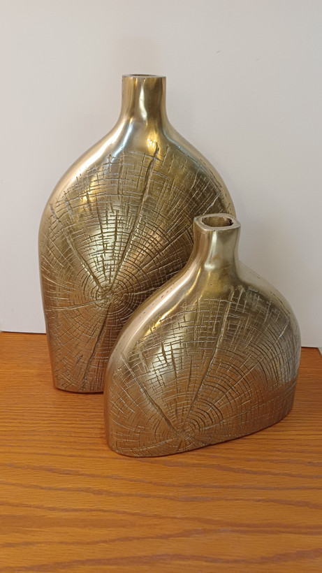 “Minimalist aluminum decorative vase named Penelope, a sophisticated accent piece for any room.”