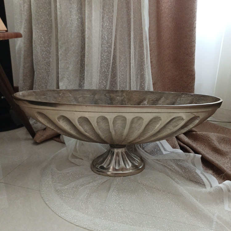 Decorative modern aluminum vase with distinctive Kashkool design, ideal for console and table display.