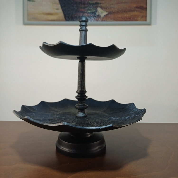 Modern double-layer aluminum serving tray featuring a lined design and elevated base for sweets and fruit.
