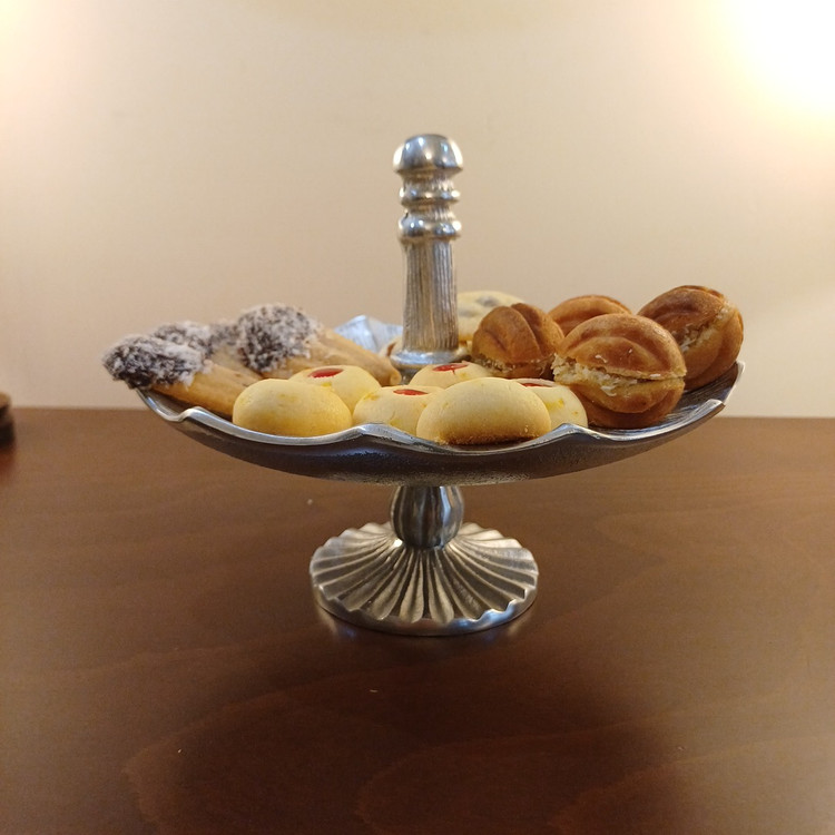 Luxury aluminum baklava serving tray with a sleek modern shape and decorative linear detailing.