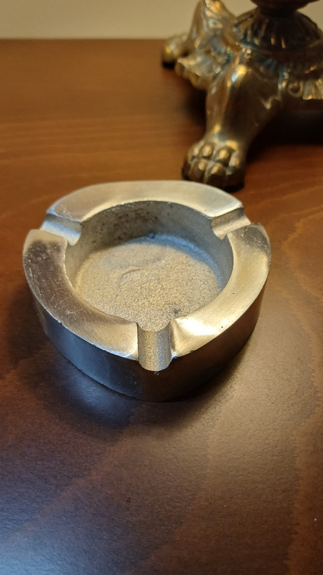 Stylish metal ashtray made of aluminum, featuring a clean contemporary look for table use.