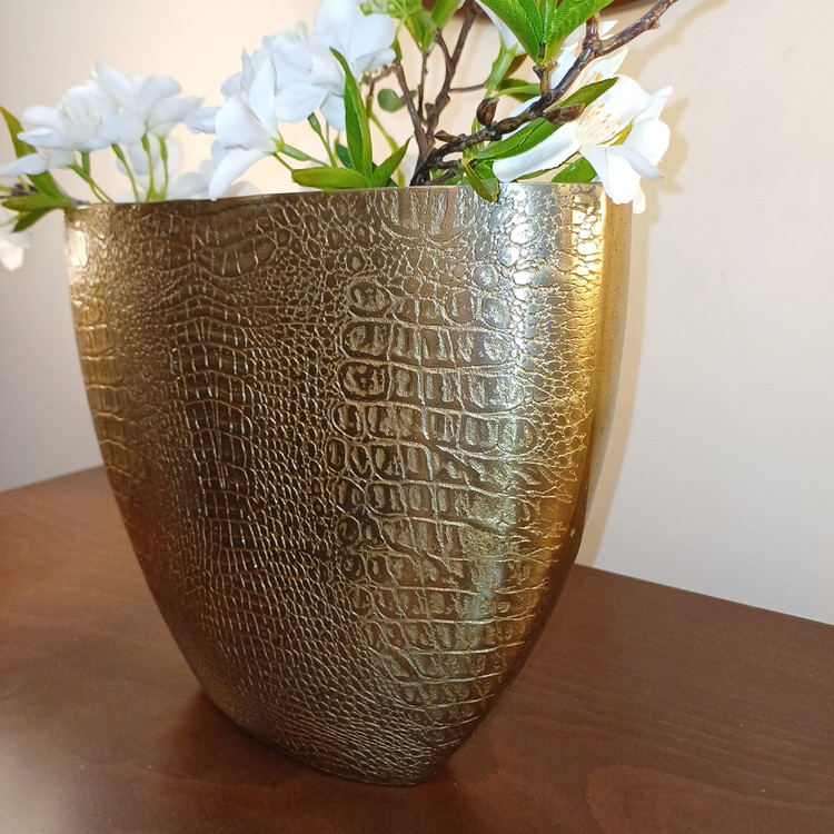 Elegant aluminum vase with a snake-skin inspired design, perfect for modern home décor and display.