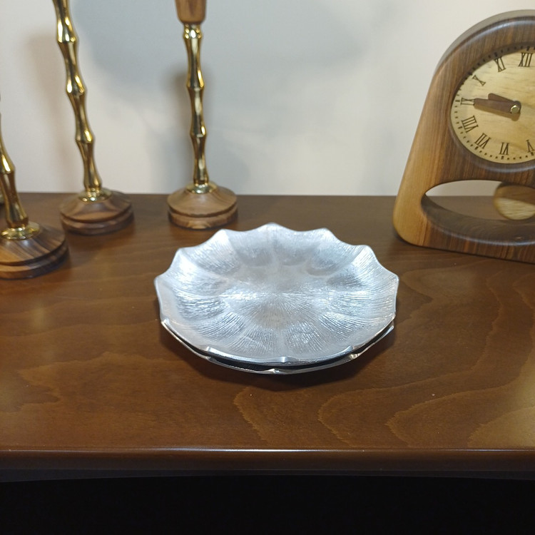 Stylish aluminum appetizer dish featuring a sleek linear pattern and contemporary look.