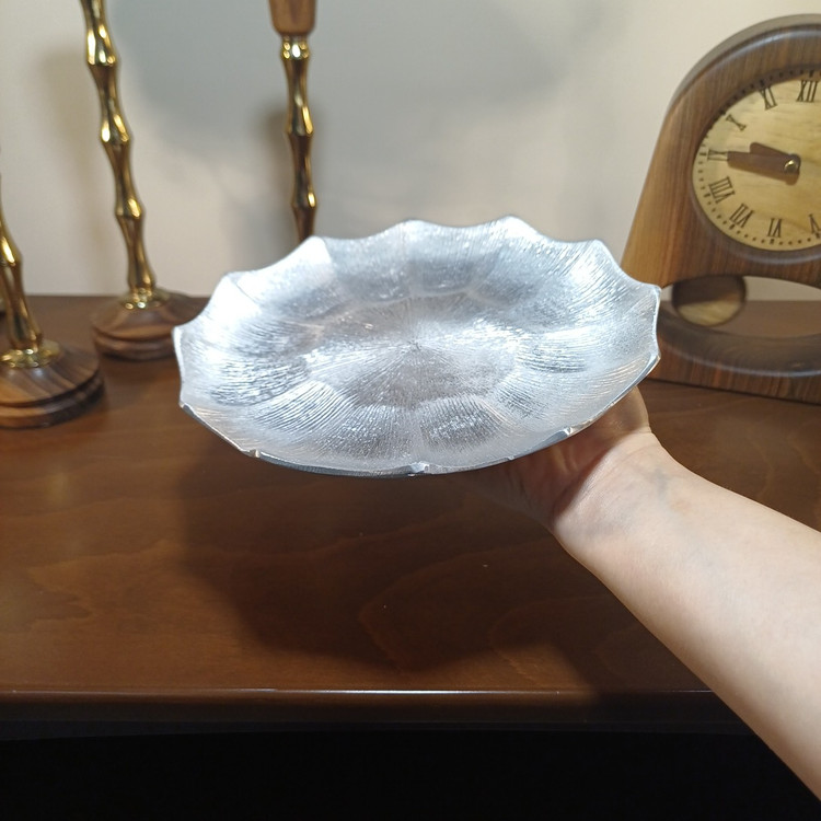 Elegant aluminum serving tray with a linear design, perfect for serving and display.