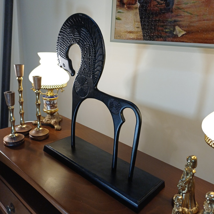Decorative winged horse figurine, blending modern aesthetics with classic motifs, ideal for sophisticated interior design.