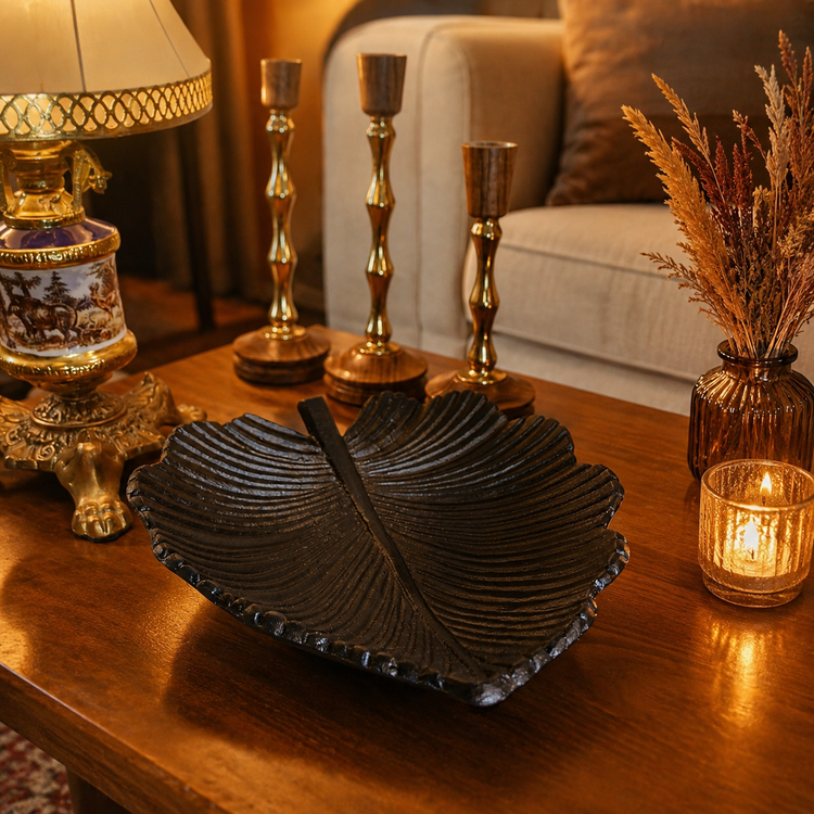 Black luxury leaf-shaped serving tray “Silk model” for nuts, chocolate and snacks on modern table setting