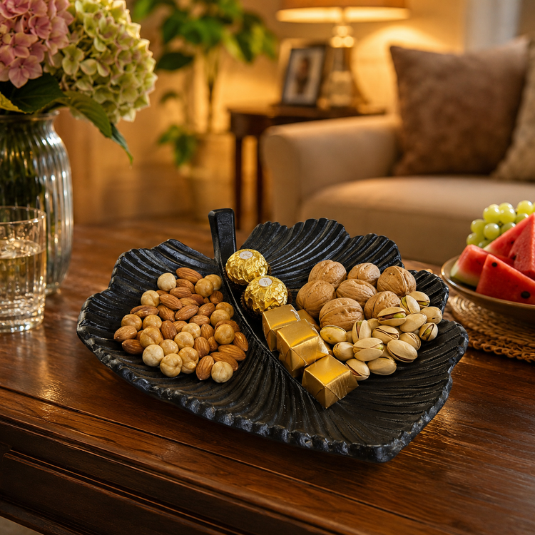 Black luxury leaf-shaped serving tray “Silk model” for nuts, chocolate and snacks on modern table setting