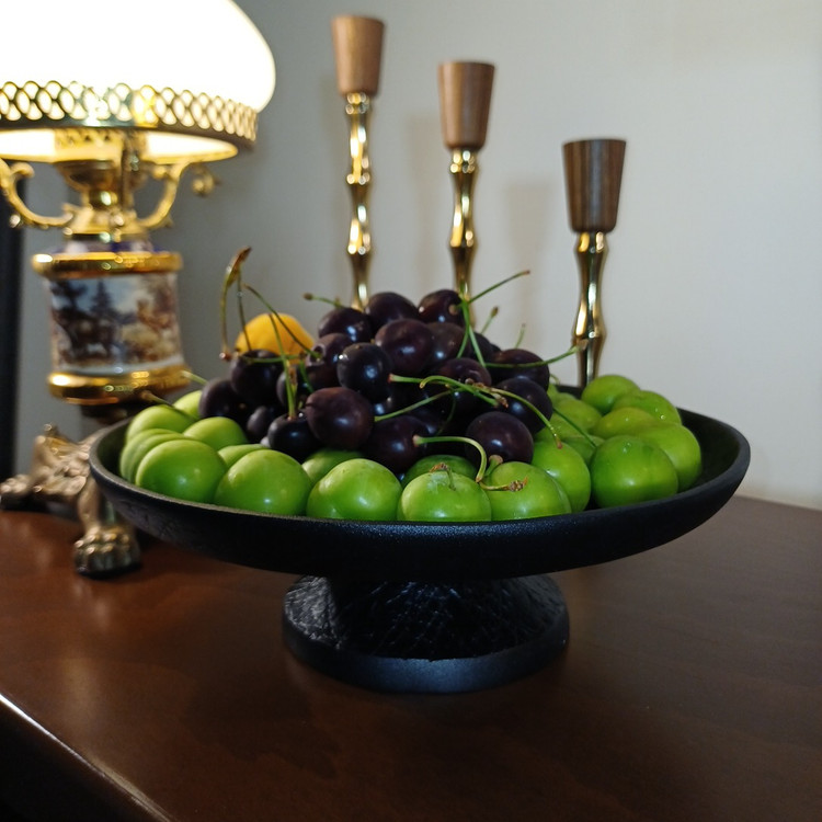 Luxury modern aluminum serving dish on pedestal with abstract line pattern, elegant home dining table setup