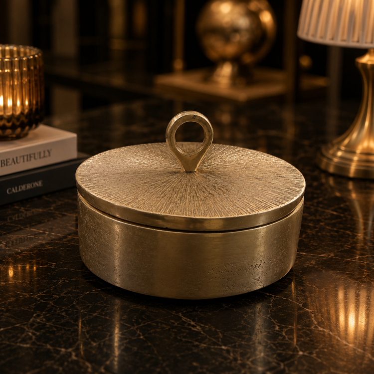 Decorative lidded chocolate dish made of aluminum, designed in a chic linear style for home decor.